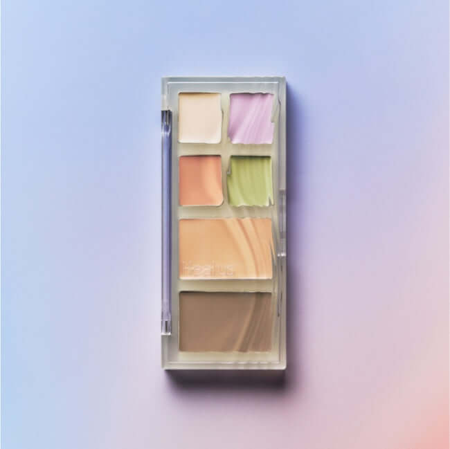 HEALUS Breath Concealer Palette with multiple color options for flawless coverage against pastel background.