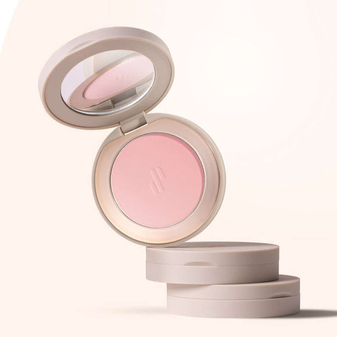 HEART PERCENT Dot On Mood Blurry Blush in an open compact showcasing the soft pink shade for a subtle, natural look.