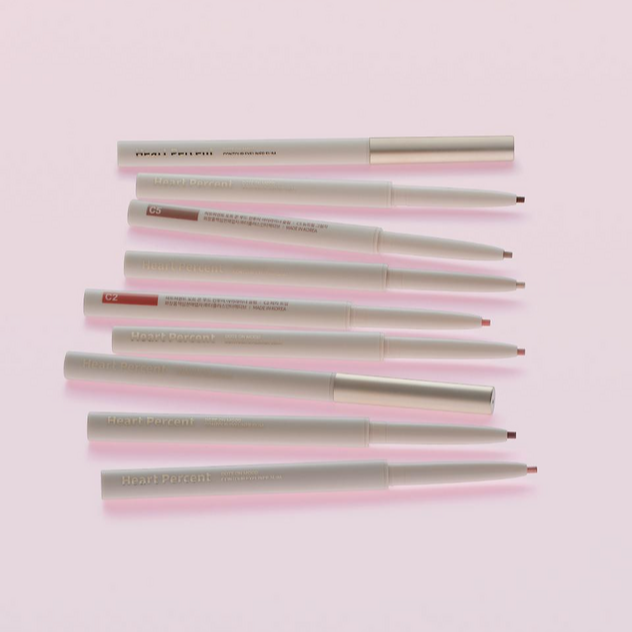 HEART PERCENT Dot On Mood Contour Eyeliner Slim in assorted shades on a pink background