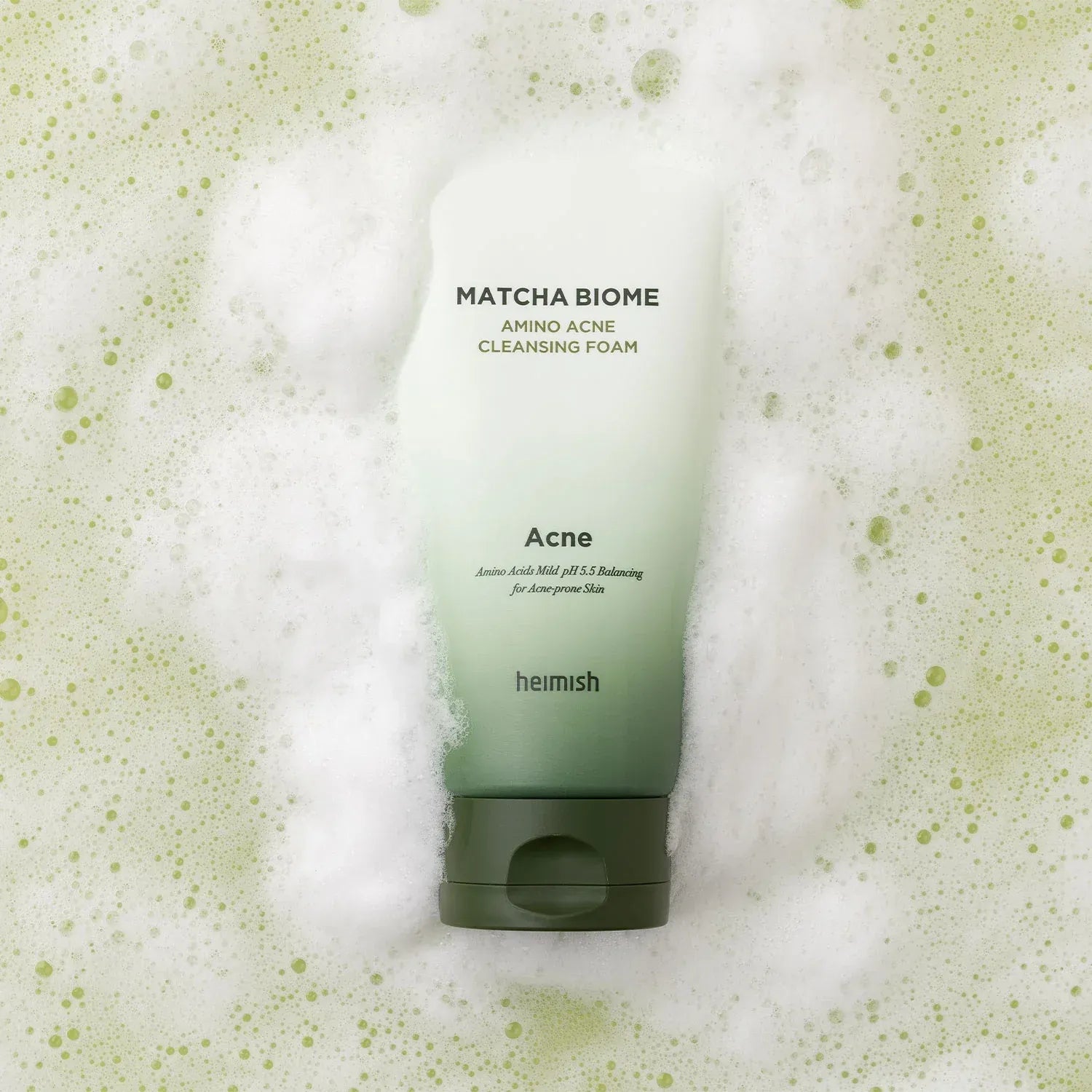 HEIMISH Matcha Biome Amino Acne Cleansing Foam 150g product image with foam background.