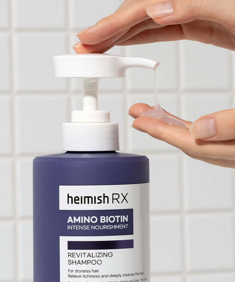 HEIMISH RX Amino Biotin Revitalizing Shampoo 400ml bottle in use against tiled background