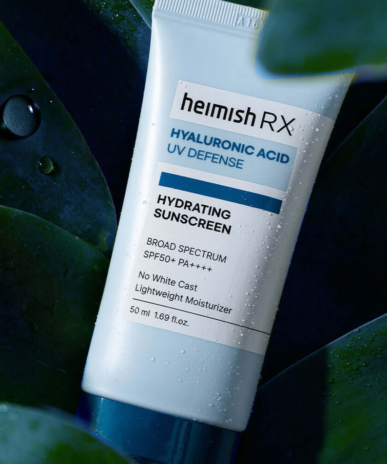 HEIMISH RX Hyaluronic Acid Hydrating Sunscreen SPF50+ PA++++ product bottle on a leafy background.