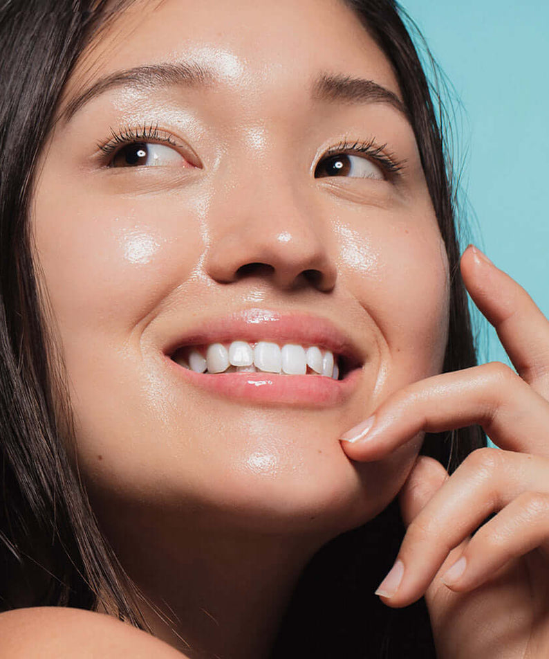 Woman with radiant skin using HEIMISH RX Hyaluronic Acid Hydrating Sunscreen SPF50+ PA++++