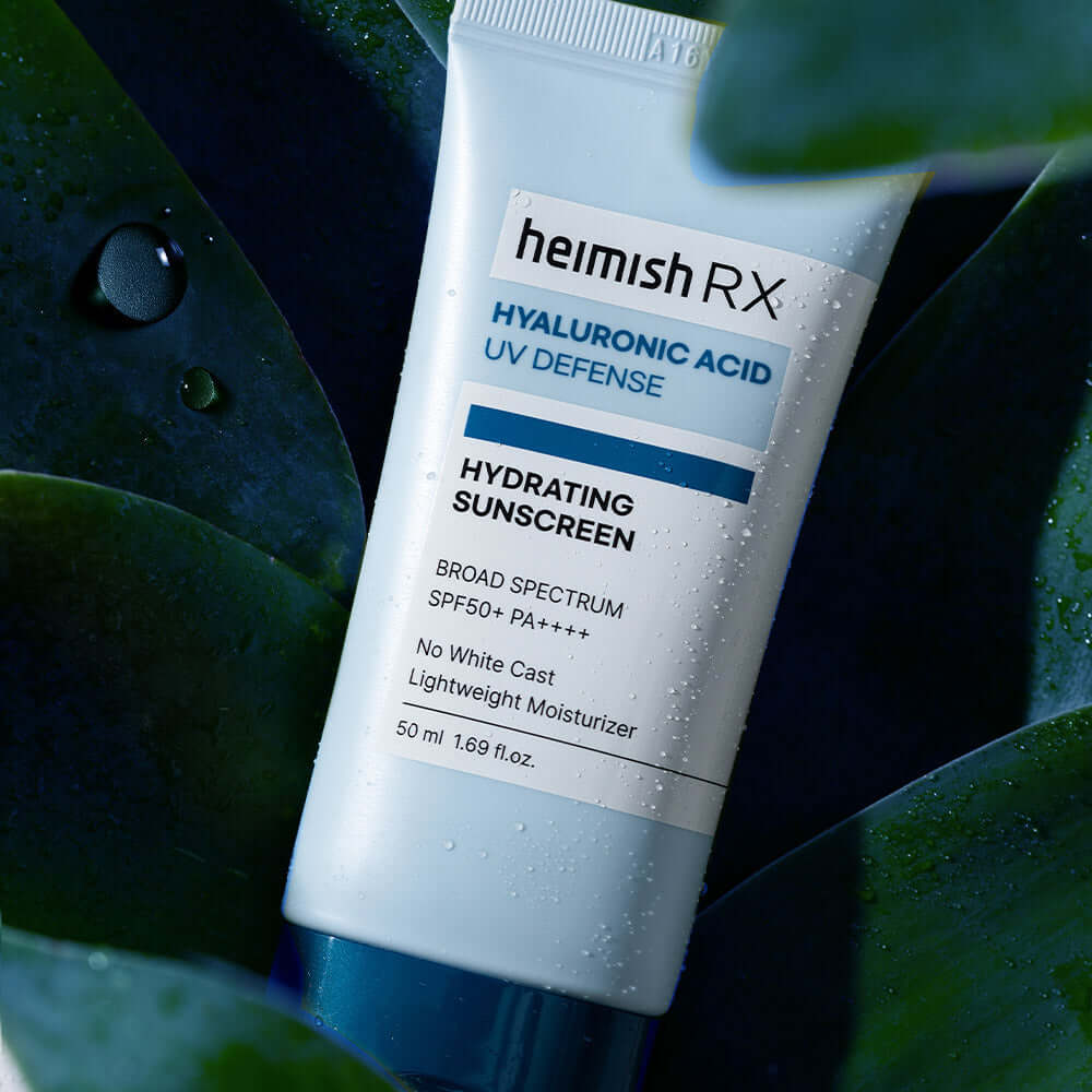 HEIMISH RX Hyaluronic Acid Hydrating Sunscreen SPF50+ PA++++ product bottle on a leafy background.