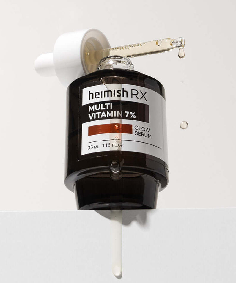 HEIMISH RX Multi Vitamin Glow Serum 35ml with dropper shown releasing serum against white background.