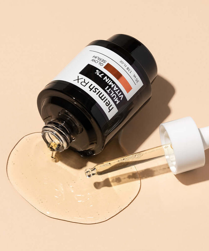 HEIMISH RX Multi Vitamin Glow Serum 35ml bottle with dropper against a beige background, highlighting skincare serum texture and packaging.