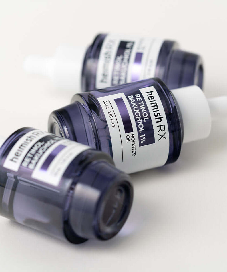 HEIMISH RX Retinol Bakuchiol Booster Oil 35ml bottles lying on a white surface