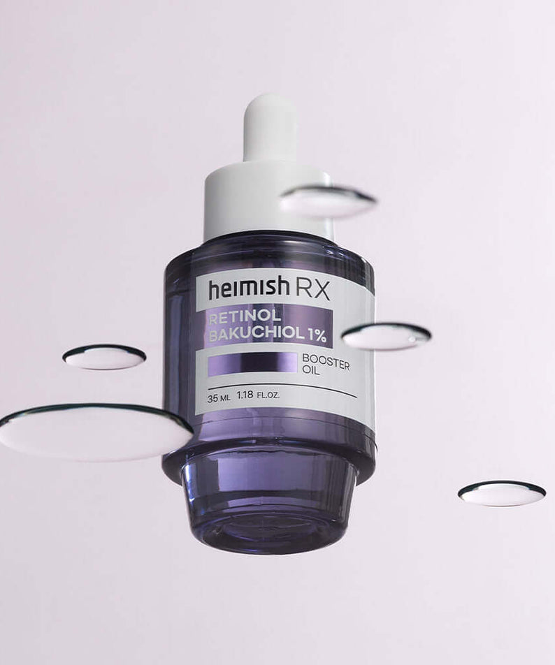 HEIMISH RX Retinol Bakuchiol Booster Oil 35ml purple bottle floating with liquid droplets