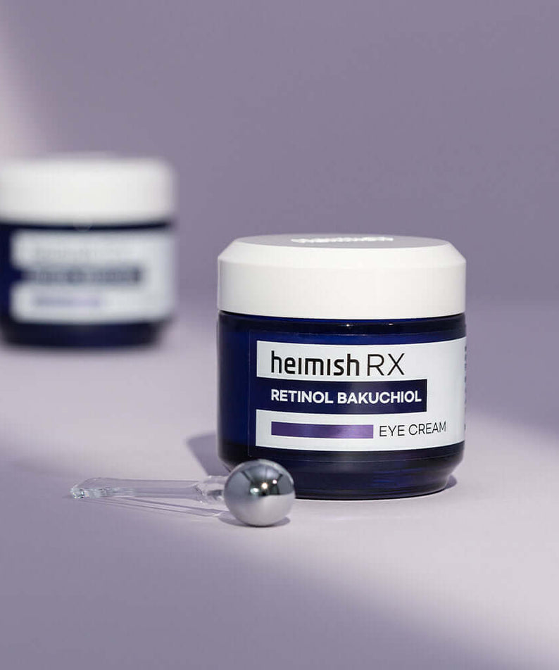 HEIMISH RX Retinol Bakuchiol Eye Cream 30ml with applicator on purple background