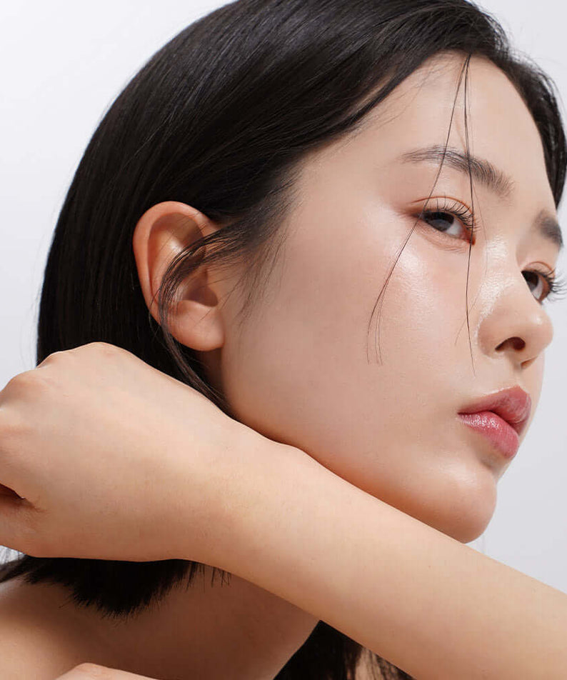 Woman with glowing skin using HEIMISH RX Retinol Bakuchiol Eye Cream 30ml