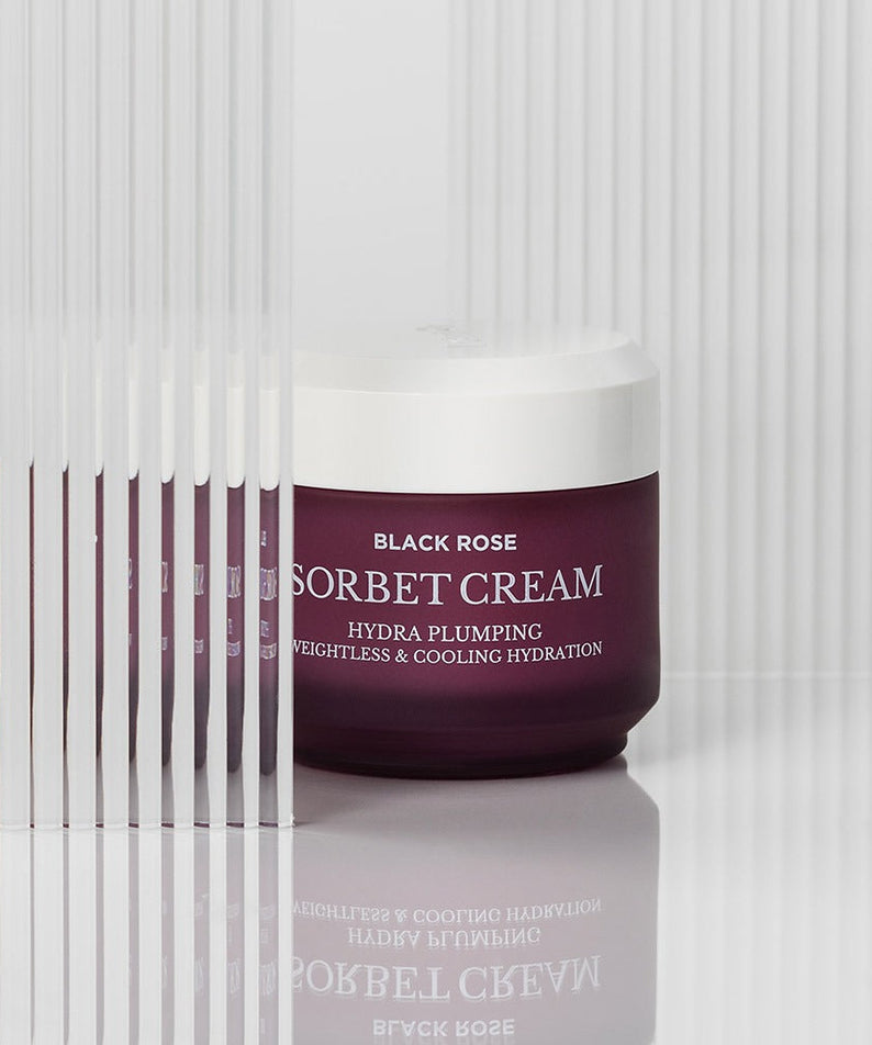 HEIMISH Black Rose Hydra Plumping Shavet Cream 50ml jar on a white background with reflective surface.