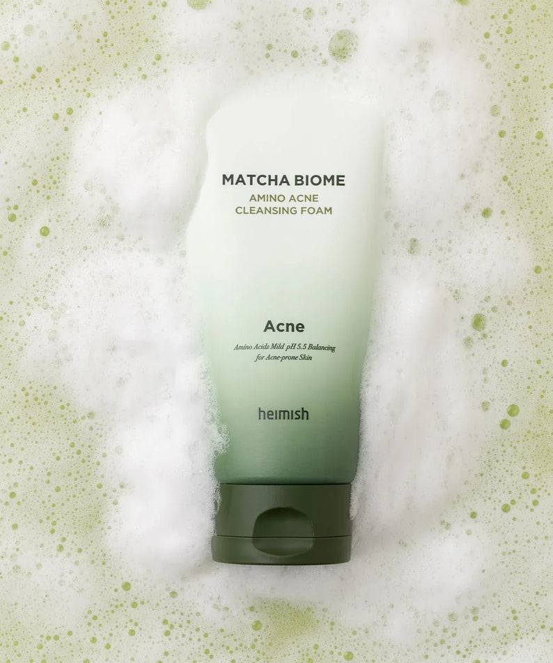HEIMISH Matcha Biome Amino Acne Cleansing Foam 150g product image with foam background.