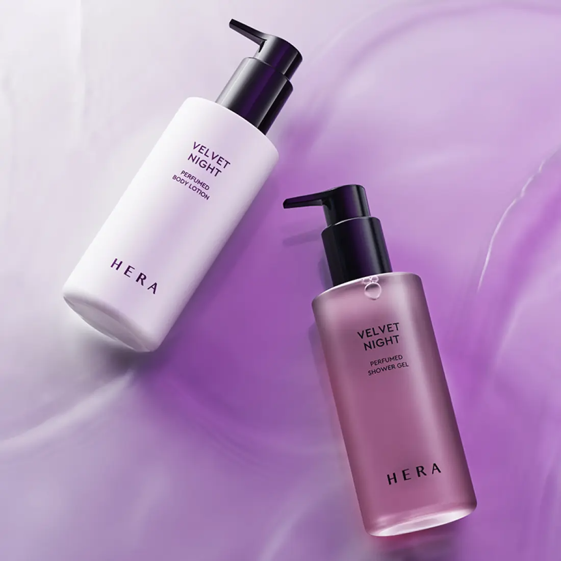HERA Velvet Night Perfumed Shower Gel 250g bottle on a purple background with matching body lotion.