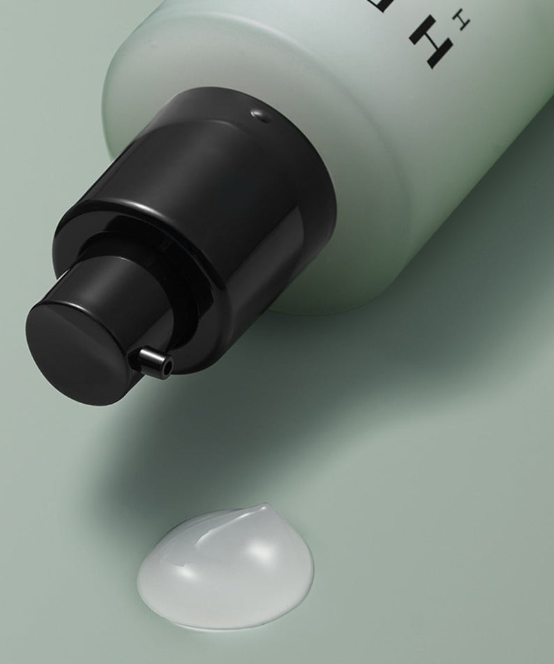 HERA Homme All-in-One Skin Hydro Treatment 150ml bottle pump close-up with gel drop - Gentleman Korea Korean men's skincare