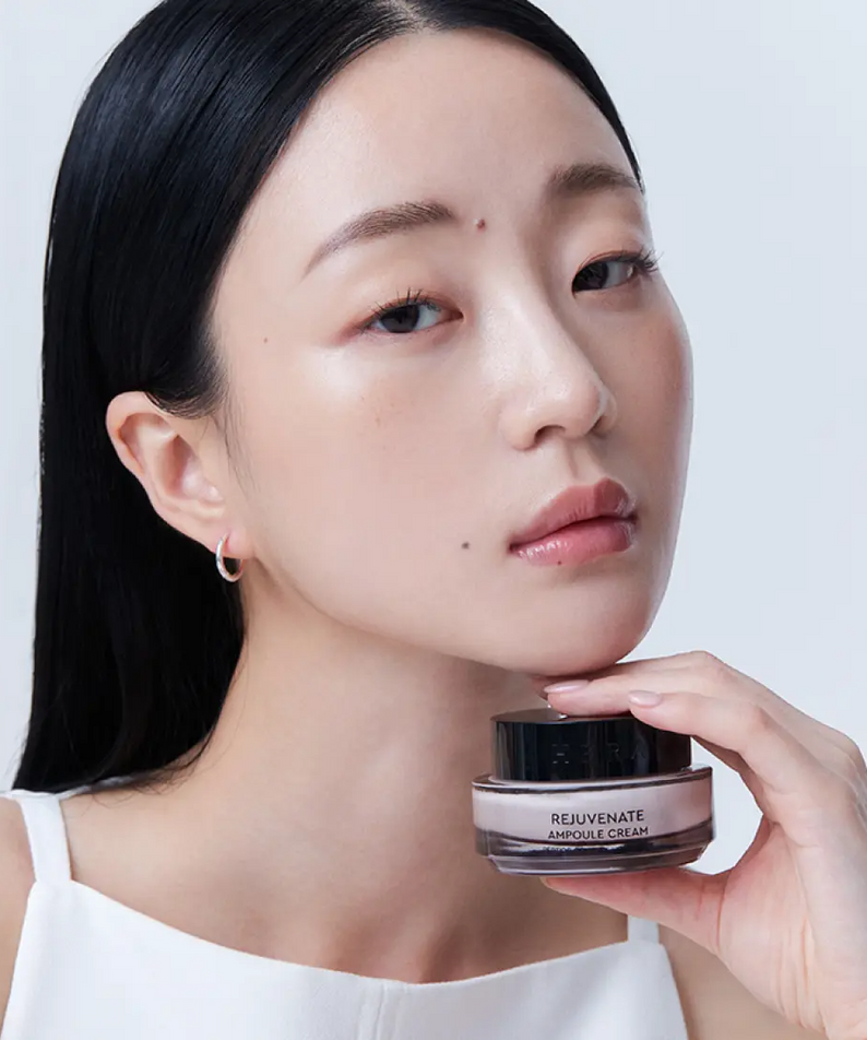 Woman holding HERA Rejuvanate Ampoule Cream 50ml product