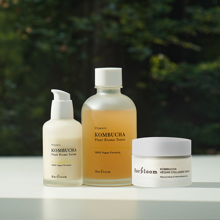 HERBLOOM Kombucha Slow Aging Set (Serum + Toner + Cream) in an outdoor setting.
