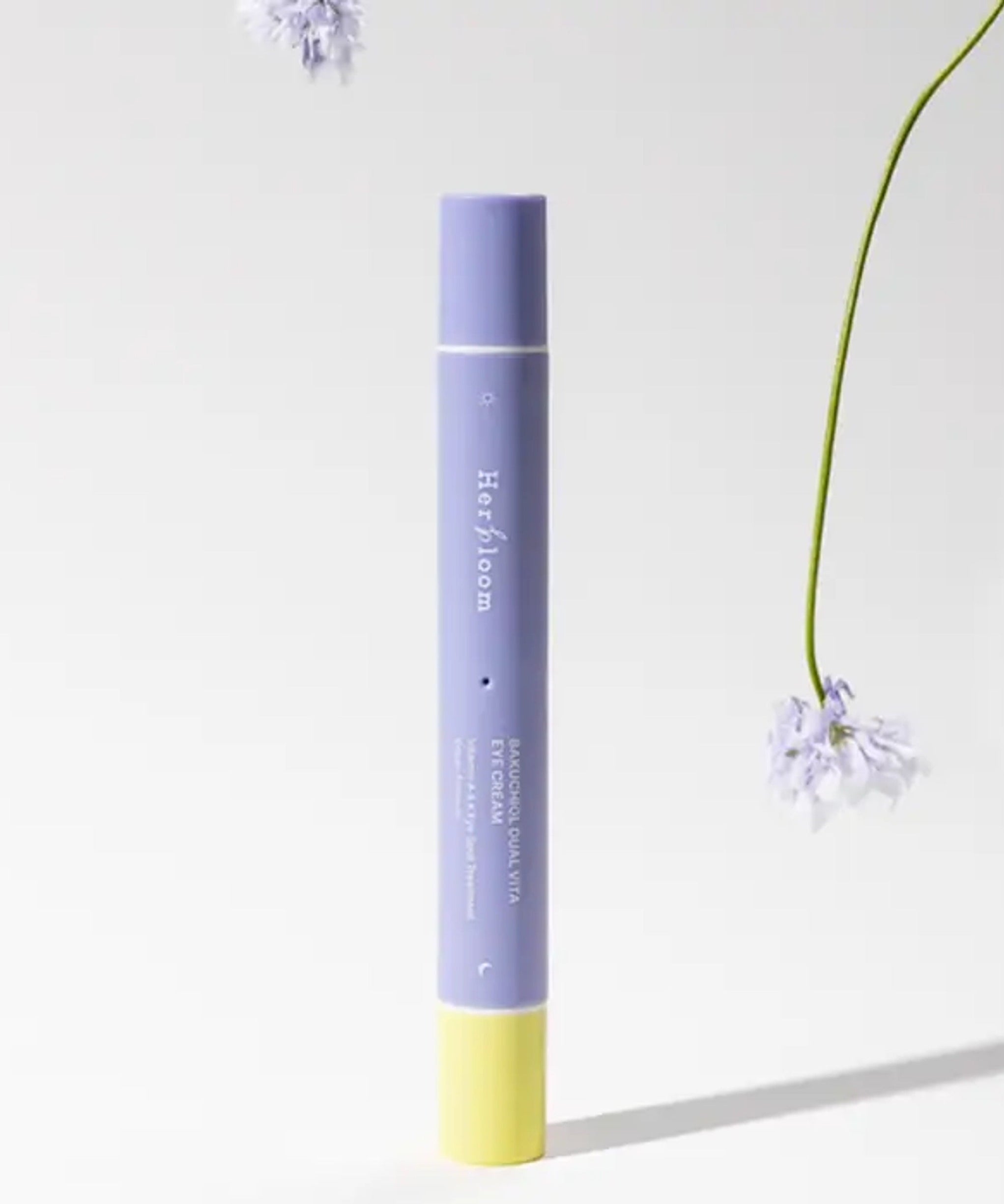 HERBLOOM Bakuchiol Dual Vita Eye Cream tube with flowers on a white background