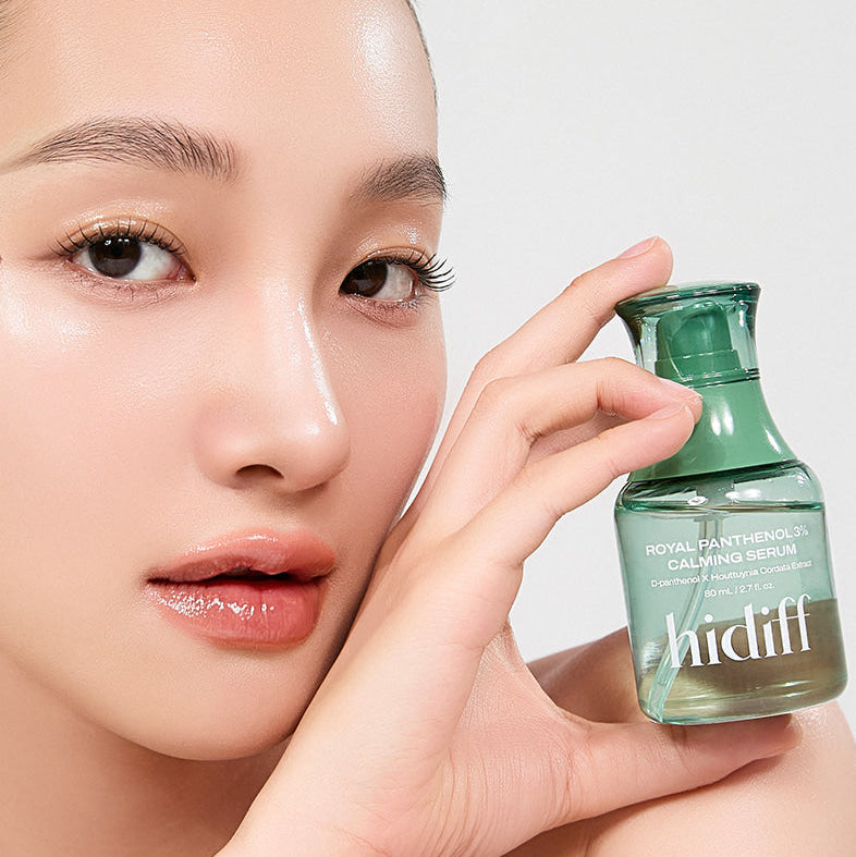 Woman holding HIDIFF Royal Panthenol 3% Calming Serum bottle close up