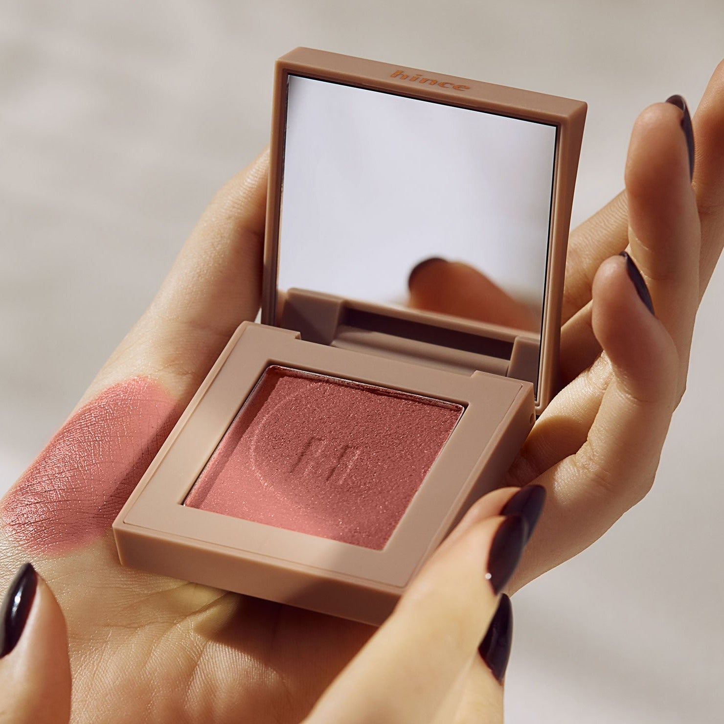 HINCE New Depht Eye Shadow in compact case with mirror, featuring swatch and elegant packaging.