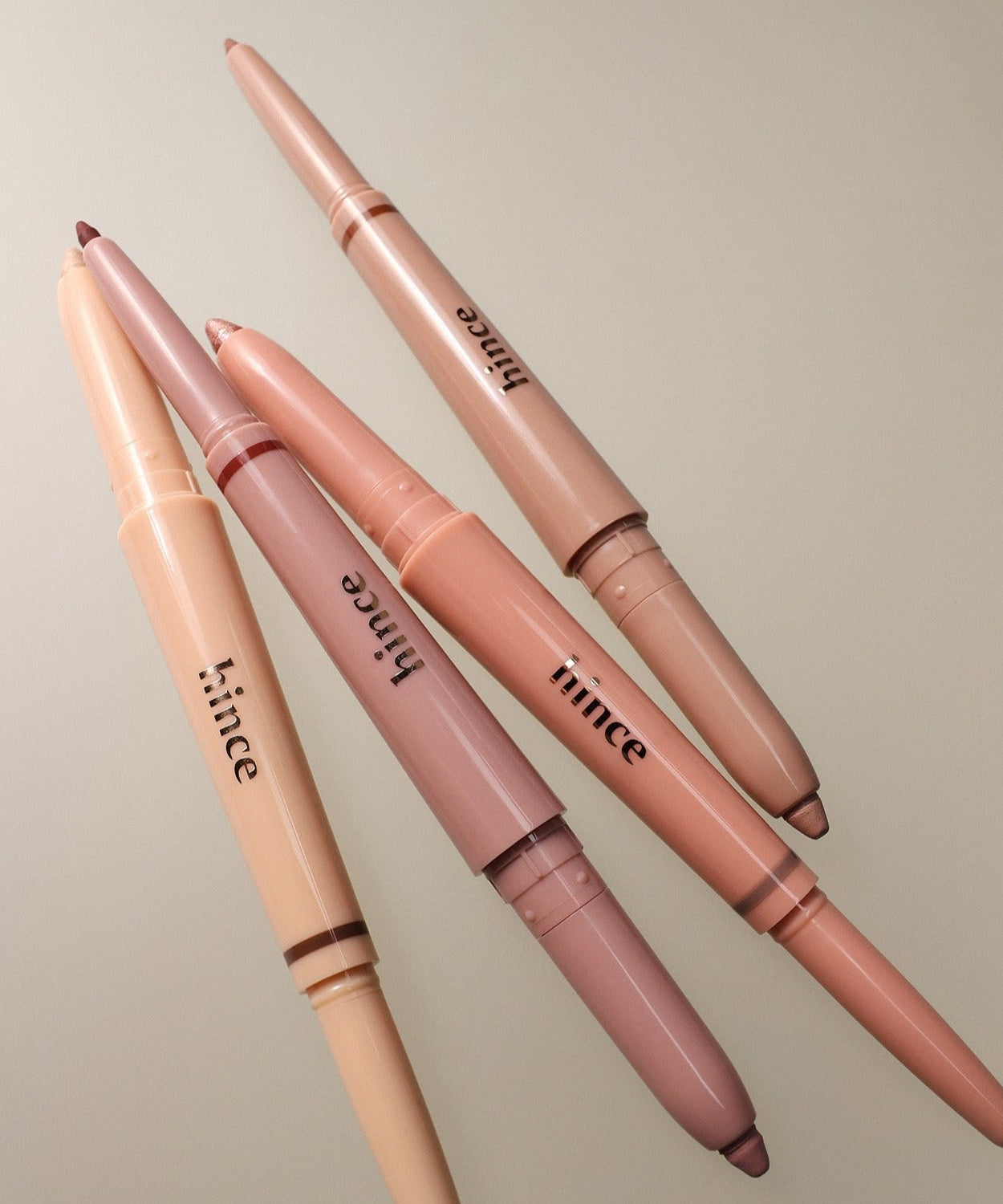 HINCE Depth Dual Color Stick lying on a neutral background, showcasing multiple shades for versatile use.