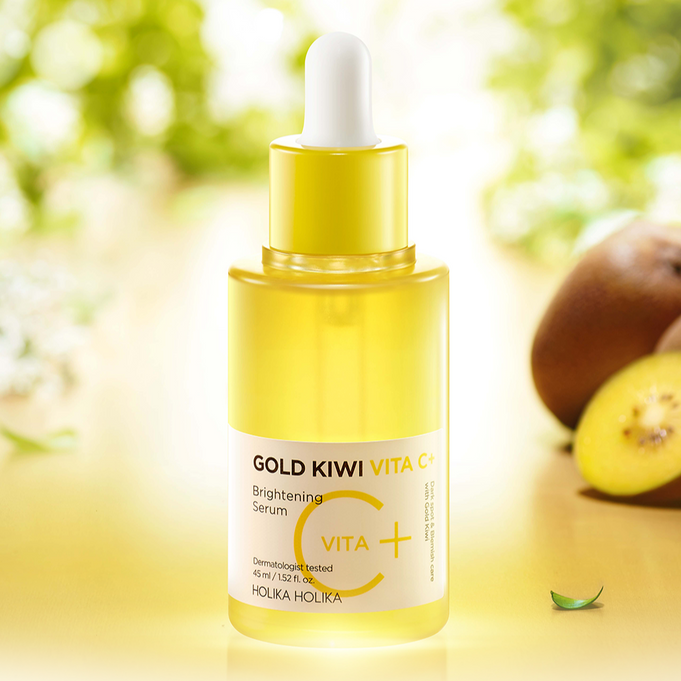 HOLIKA HOLIKA Gold Kiwi Vita C+ Brightening Serum 45ml bottle with fresh kiwi slices in the background