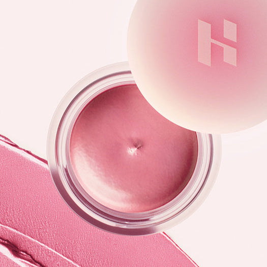 Open jar of HOLIKA HOLIKA Melting Blur Lip Pot 5g in pink shade on a light background.