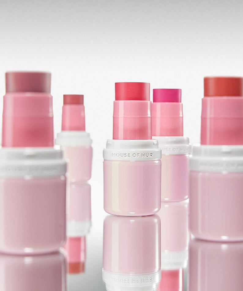 A collection of HOUSE OF HUR Every Cheek Blush products in various shades, showcasing vibrant colors and sleek packaging.