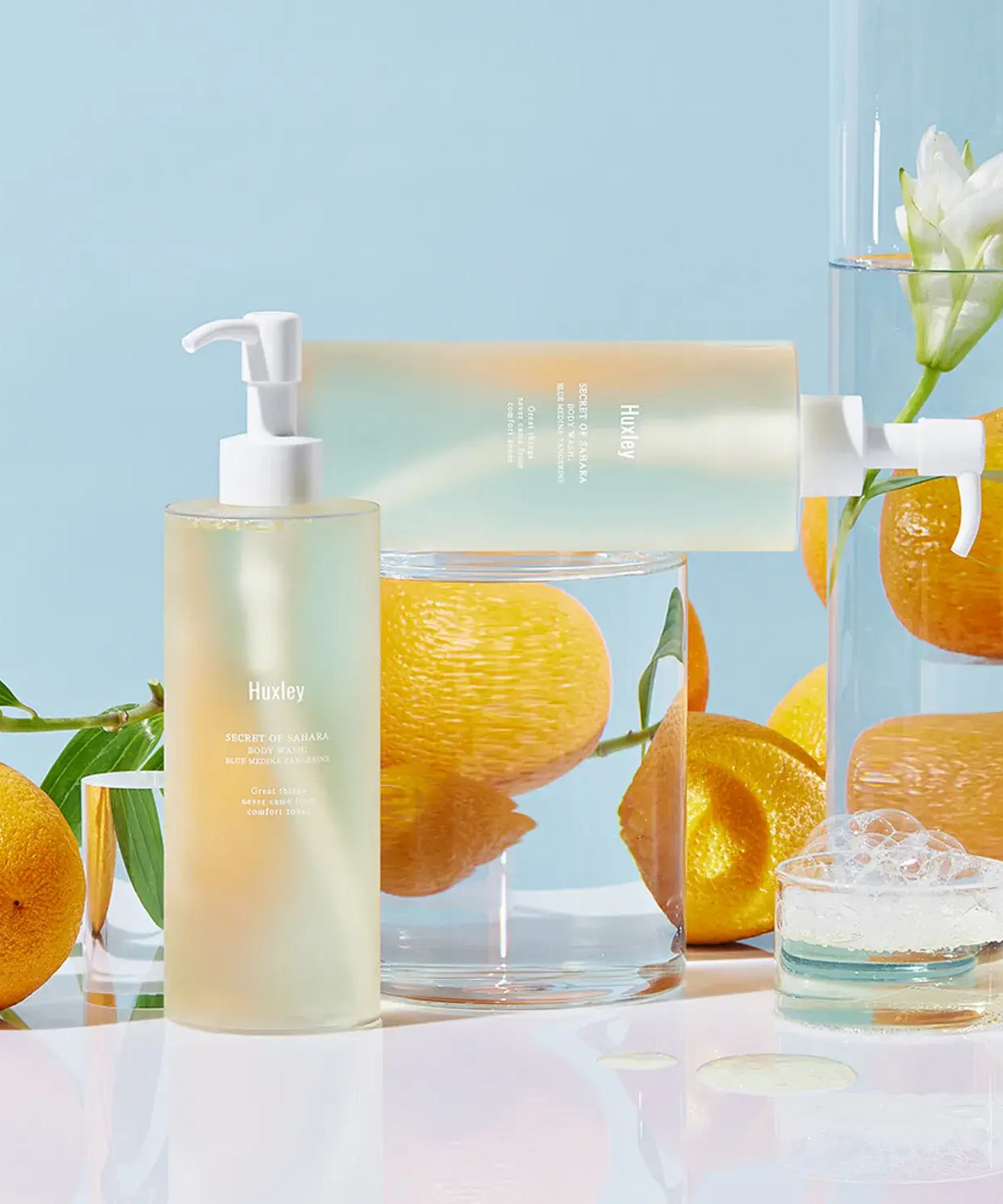 HUXLEY Body Wash Blue Medina Tangerine with fresh tangerines and floral accents for a refreshing bath experience.