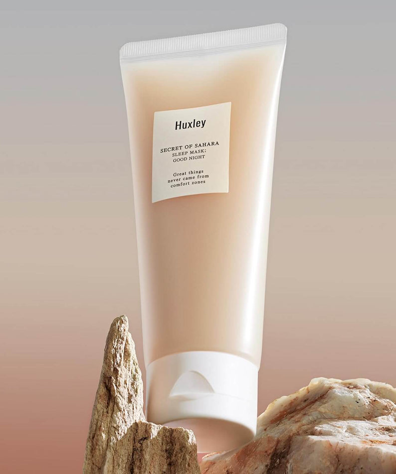 HUXLEY Sleep Mask Good Night tube displayed against natural rock background