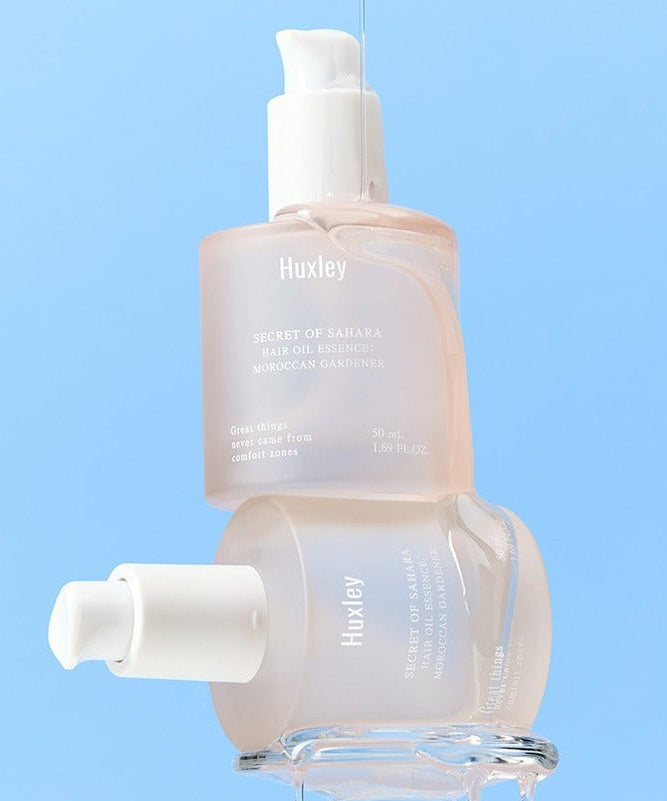 HUXLEY Hair Oil Essence Moroccan Gardener 50ml product bottle against a blue background