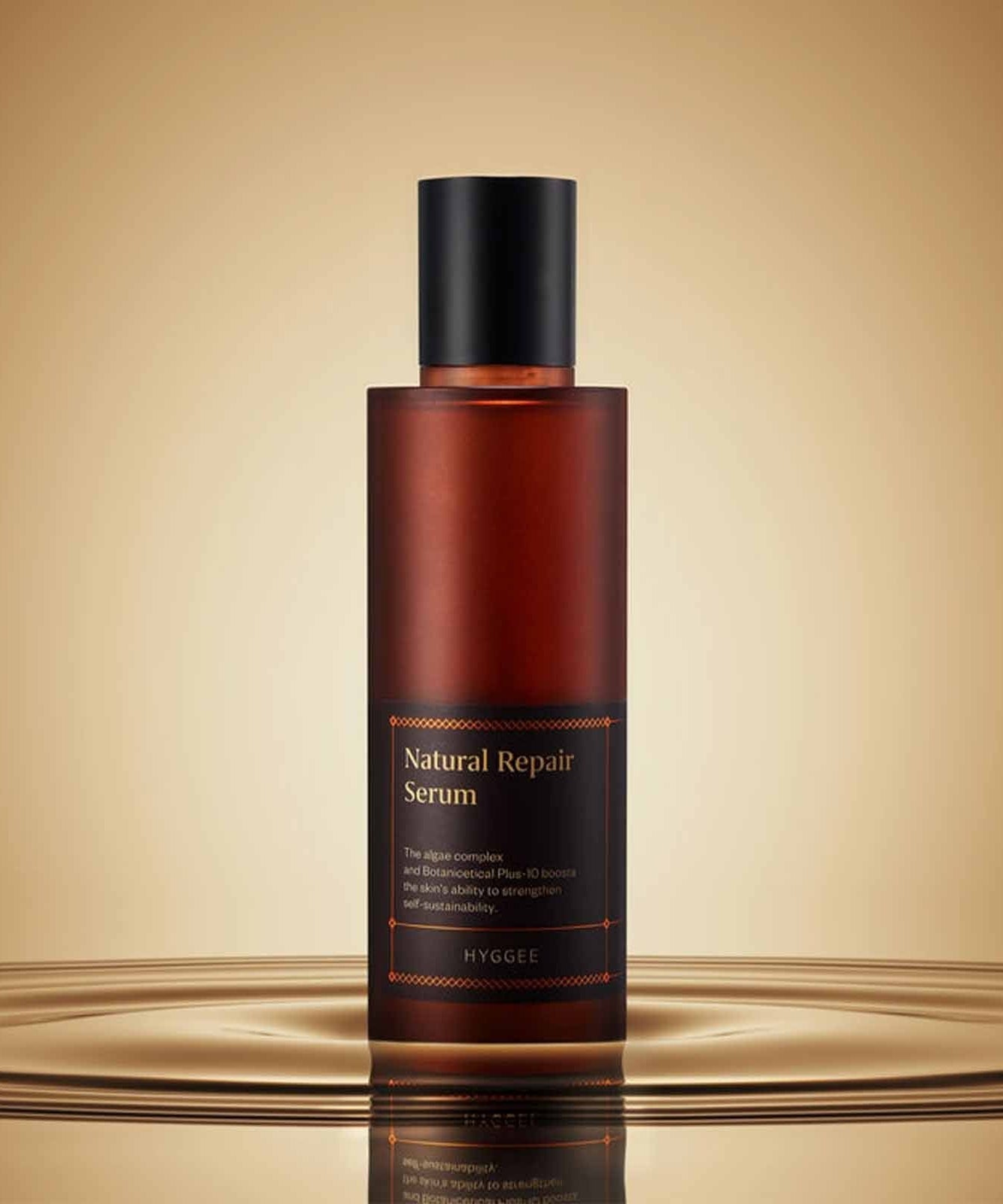 HYGGEE Natural Repair Serum 120ml bottle on a stylish reflective surface.