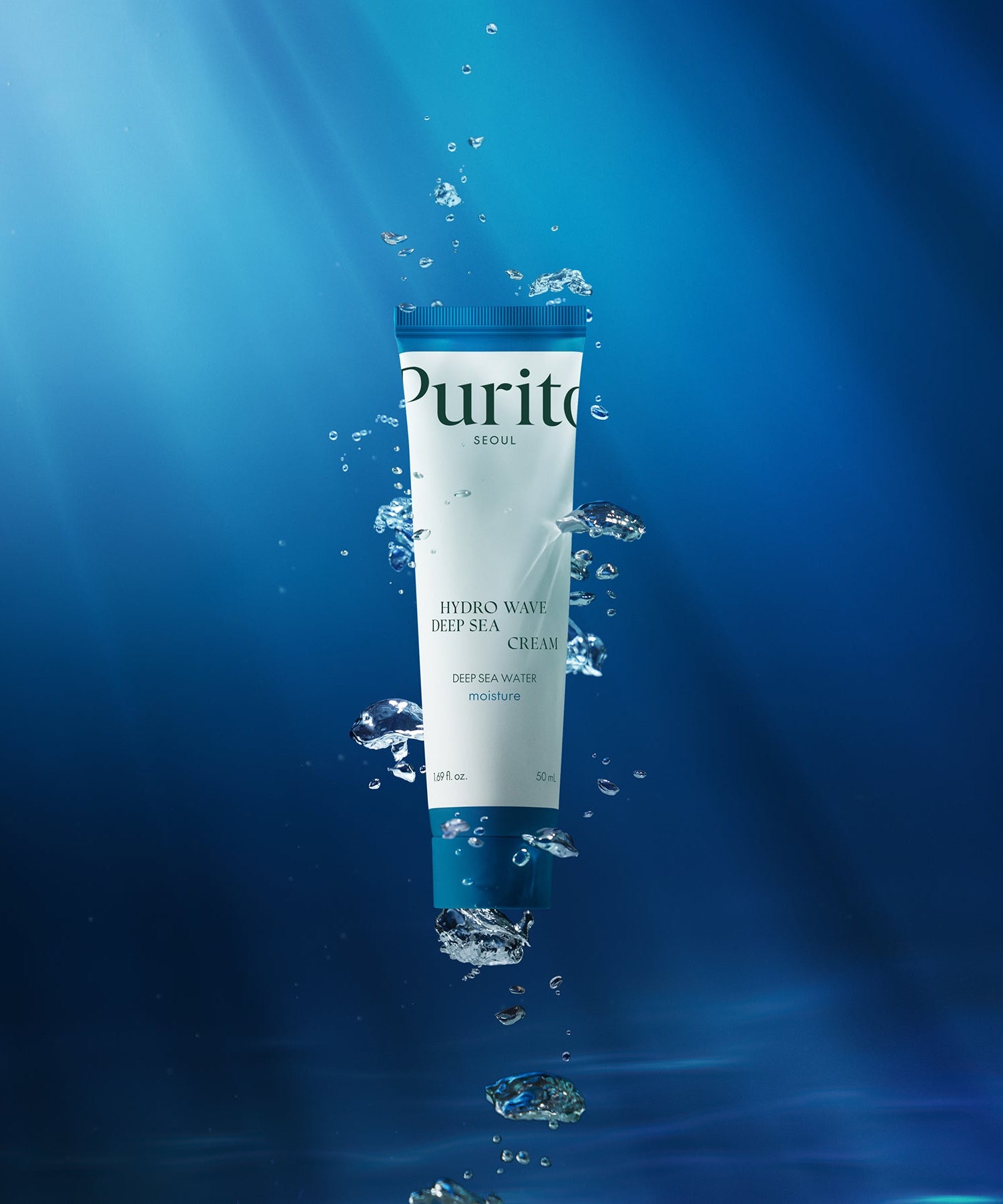 Image of PURITO Hydro Wave Deep Sea Cream 50ml floating underwater, showcasing its moisture-rich formula in a vibrant blue aquatic environment.