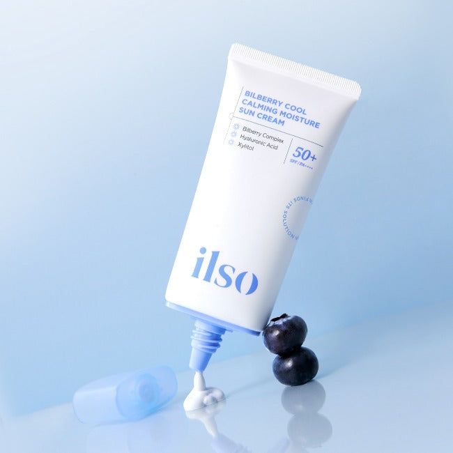 ILSO Bilberry Cool Calming Moisture Sunscreen tube with bilberries and spilled cream on a light blue background