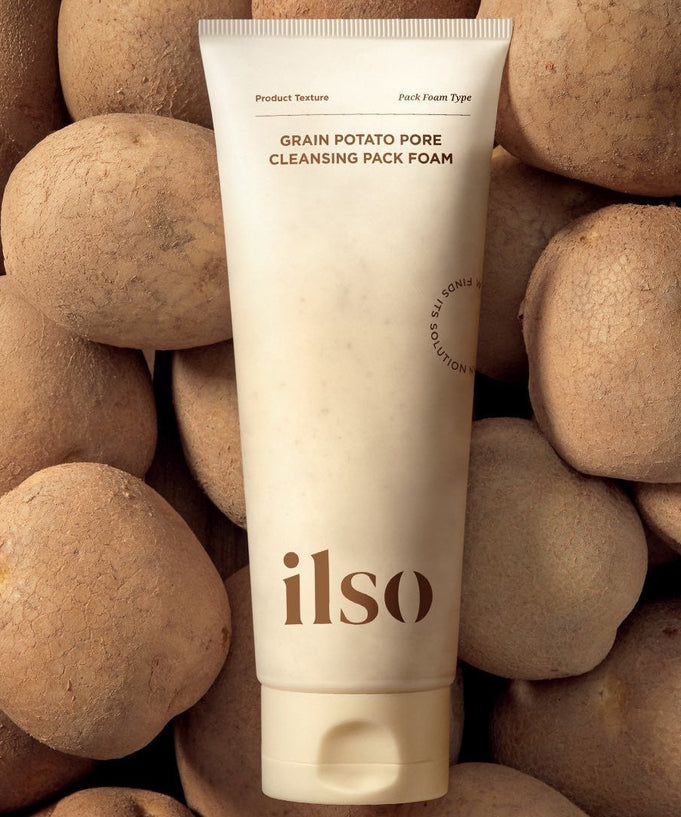 ILSO Grain Potato Cleansing Pack Foam 150ml tube with potatoes in the background, highlighting its natural ingredients and texture.