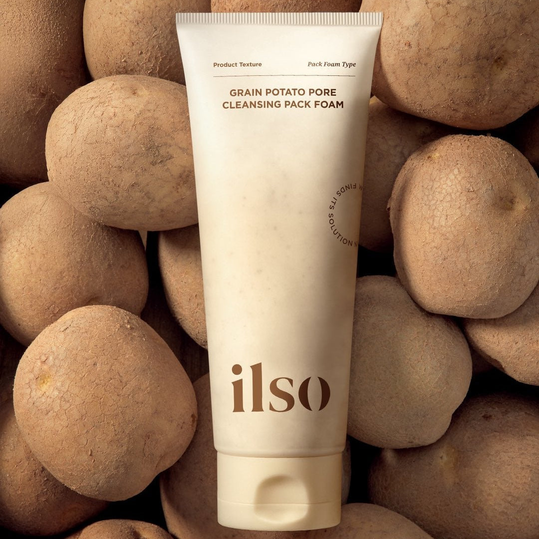 ILSO Grain Potato Cleansing Pack Foam 150ml tube with potatoes in the background, highlighting its natural ingredients and texture.