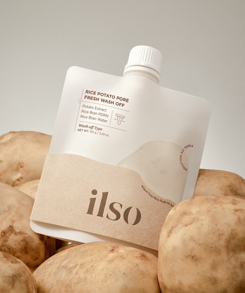 ILSO Rice Potato Pore Fresh Wash-Off 150g skincare product with natural ingredients, surrounded by potatoes.
