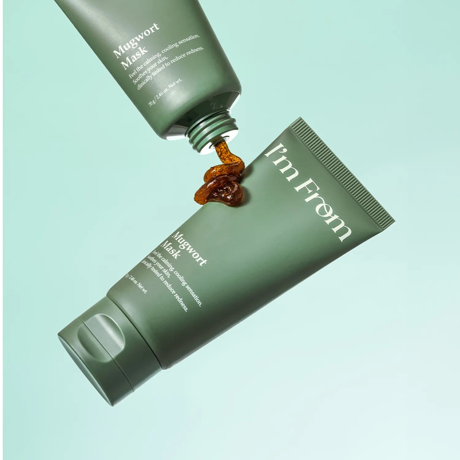 I'M FROM Mugwort Mask 70g tube with product flowing, highlighting the Korean skincare mask for soothing and calming the skin.