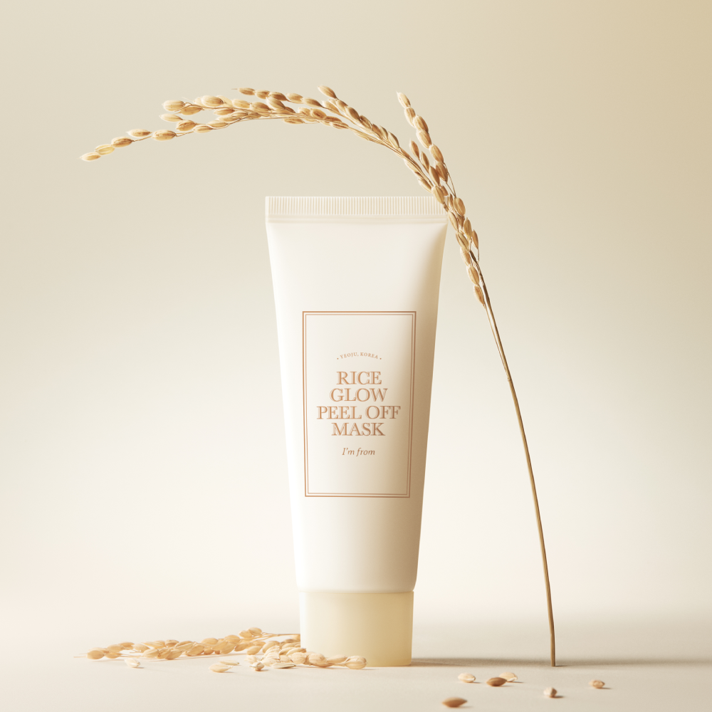 I'M FROM Rice Glow Peel Off Mask 70g in sleek packaging with rice grains and plant detail for luxurious skincare