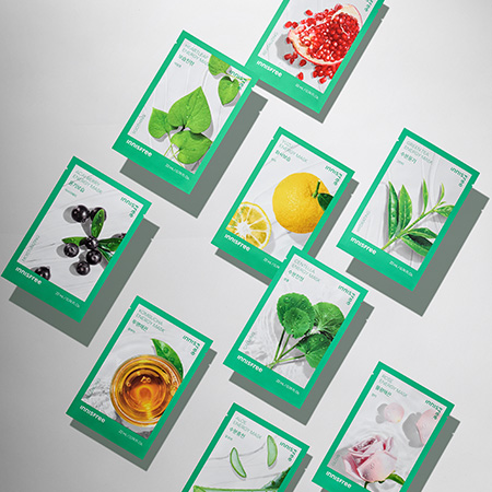 Assorted INNISFREE Energy Mask packets with natural ingredients displayed on a light background.
