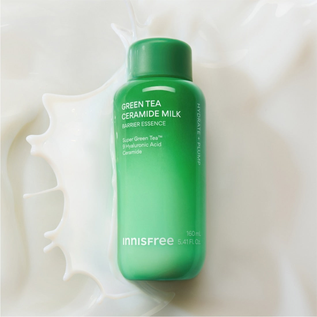 INNISFREE Green Tea Ceramide Milk Essence 160ml bottle on a milk splash background