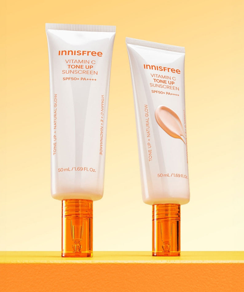 INNISFREE Vita C Spot Tone Up Sunscreen SPF50+/PA++++ 50ml tubes on a yellow background