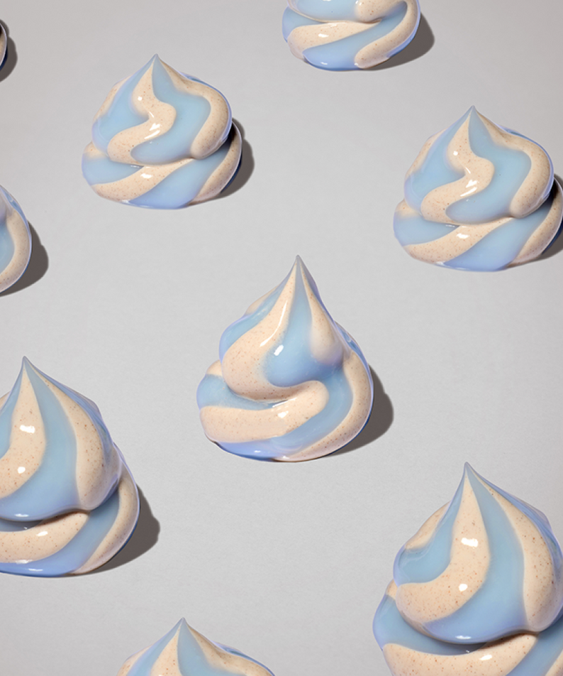 Light blue and beige meringue-like swirls on a gray background
