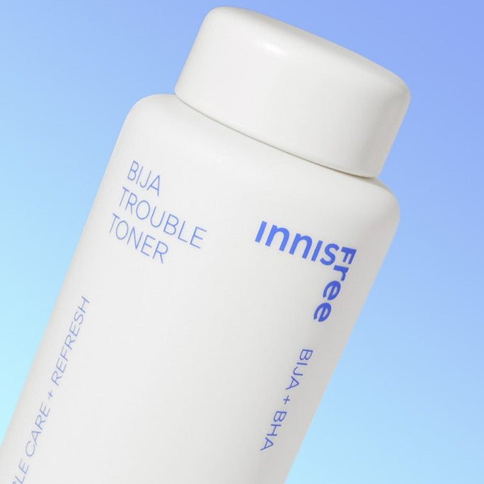 Close-up image of INNISFREE Bija Trouble Toner 170ml bottle with blue background.
