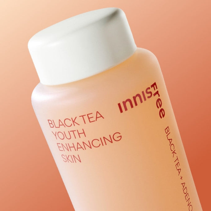 Bottle of INNISFREE Black Tea Youth Enhancing Skin 170ml with label showing product name and design.