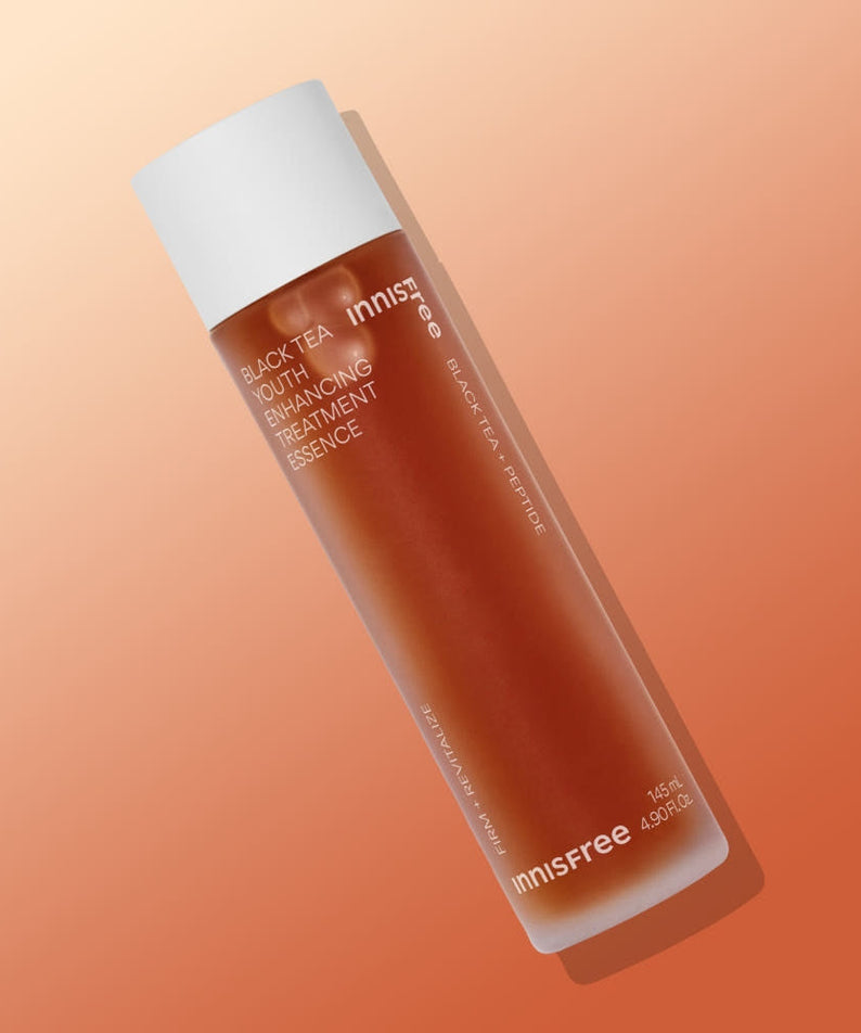 INNISFREE Black Tea Youth Enhancing Treatment Essence shown on gradient background