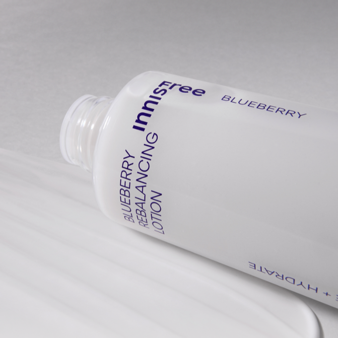 INNISFREE Blueberry Rebalancing Lotion 130ml bottle lying on its side on a white surface