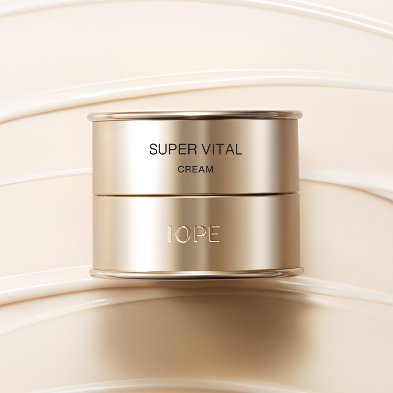 IOPE Super Vital Cream 50ml luxury skincare product in gold packaging on a cream background
