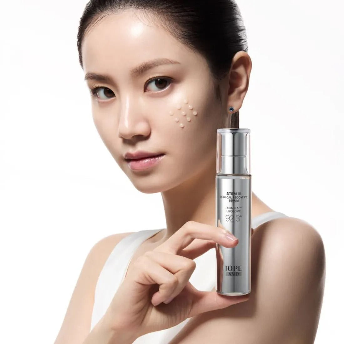 Model holding IOPE XMD Stem3 Clinic Recoery Serum 50ml