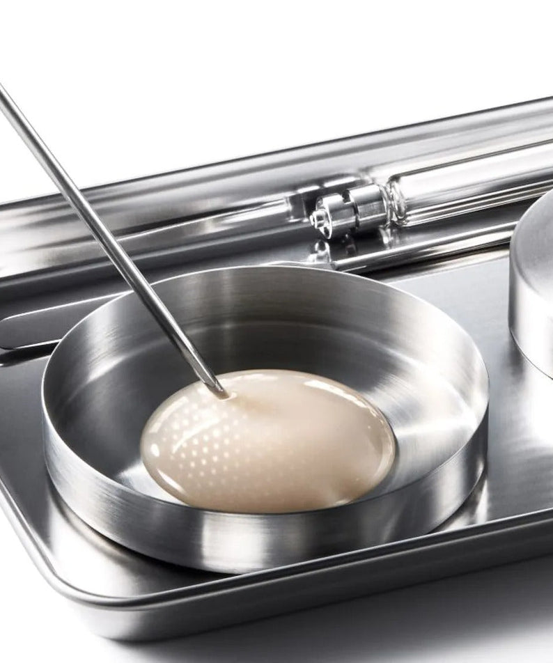 IOPE XMD Stem3 Clinic Recoery Serum 50ml in lab setting with serum sample