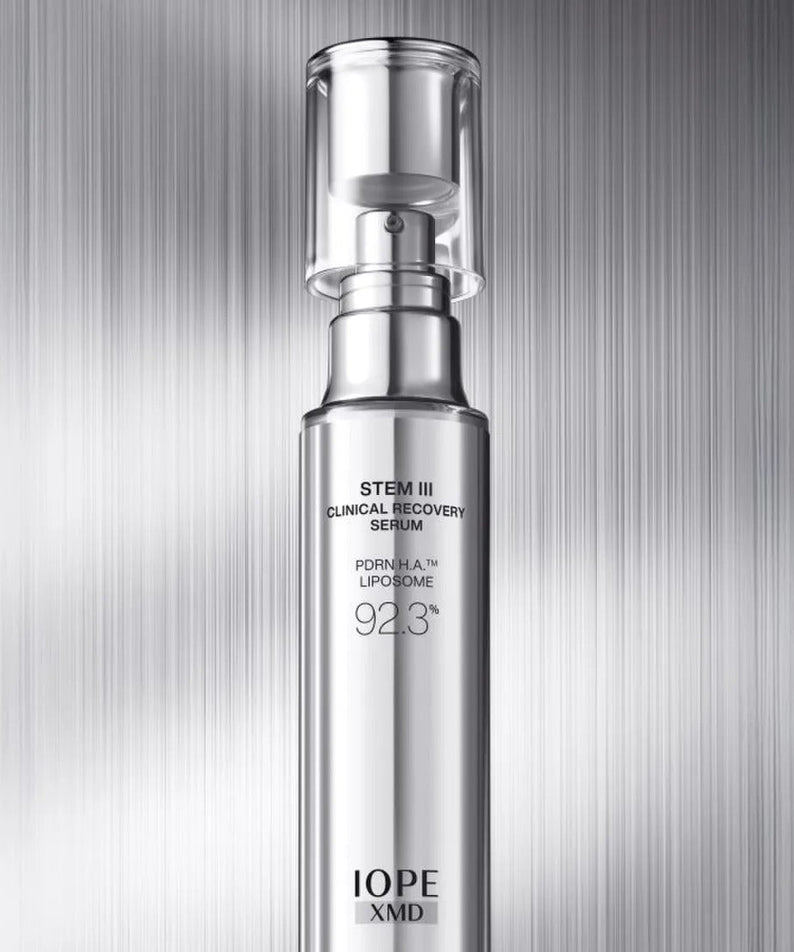 IOPE XMD Stem3 Clinic Recoery Serum 50ml bottle against metallic background